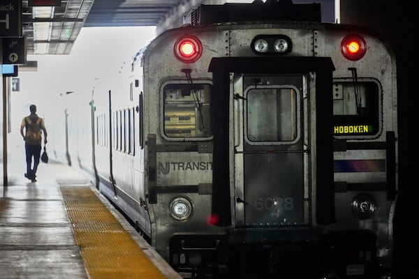 An NJ Transit train leaves the Secaucus Junction station in Secaucus, N.J., Wednesday, May 14, 2025. (AP Photo/Seth Wenig)