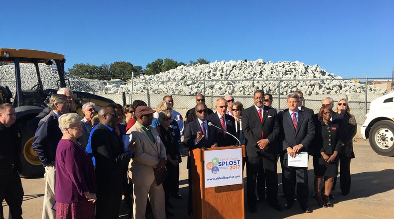 DeKalb County CEO Mike Thurmond, surrounded by mayors and government officials, speaks about the SPLOST ballot measure ahead of the 2017 vote. MARK NIESSE / MARK.NIESSE@AJC.COM