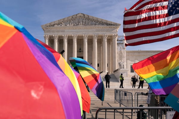 FILE - Transgenders rights supporters rally outside of the Supreme Court, Dec. 4, 2024, in Washington. (AP Photo/Jose Luis Magana, File)