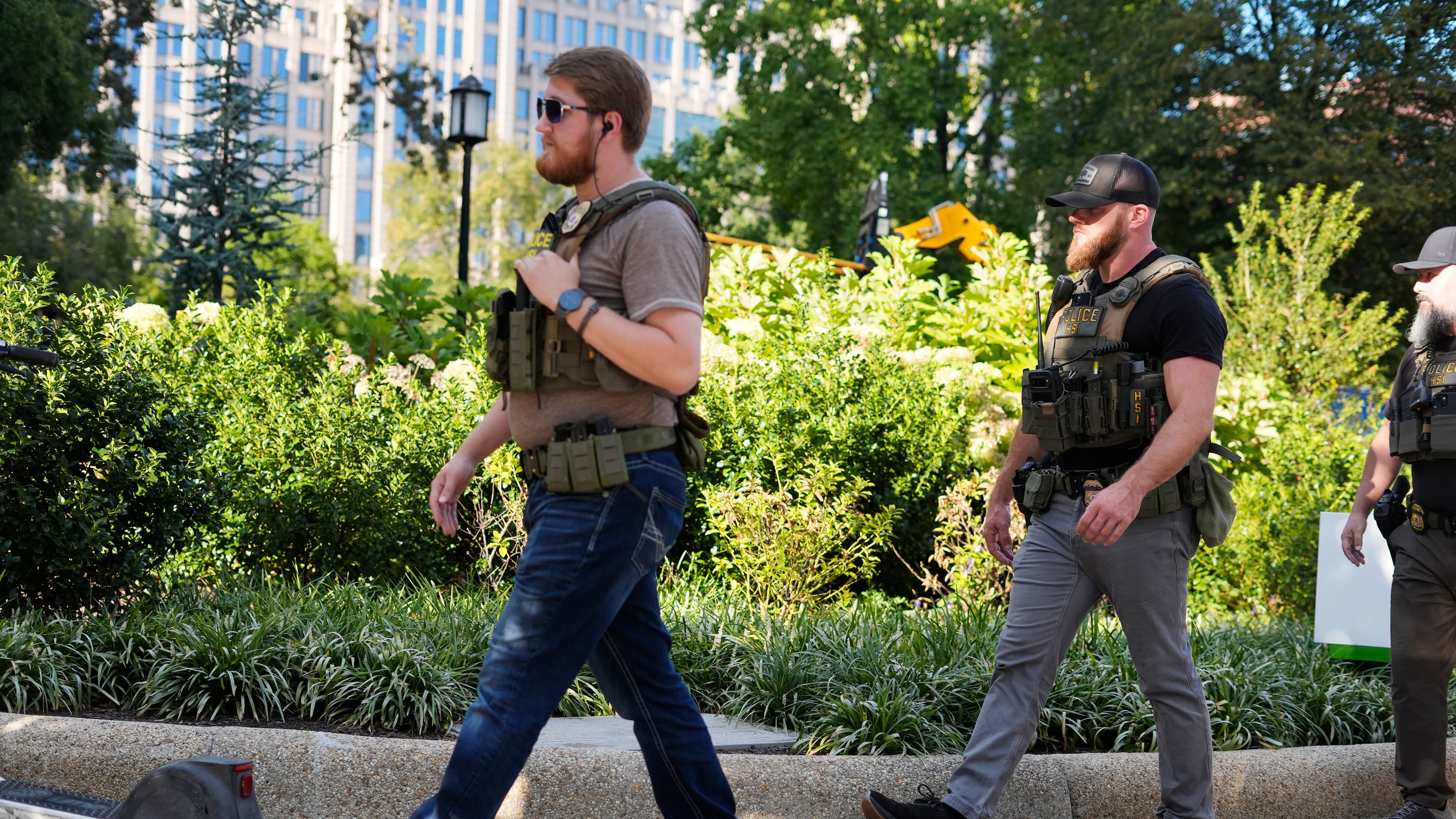 Law enforcement officer from Homeland Security Investigations (HSI) walking back to their vehicle after responding to a emergency call in Franklin Park in downtown Washington, Tuesday, Sept. 2, 2025, in Washington. (AP Photo/Pablo Martinez Monsivais)