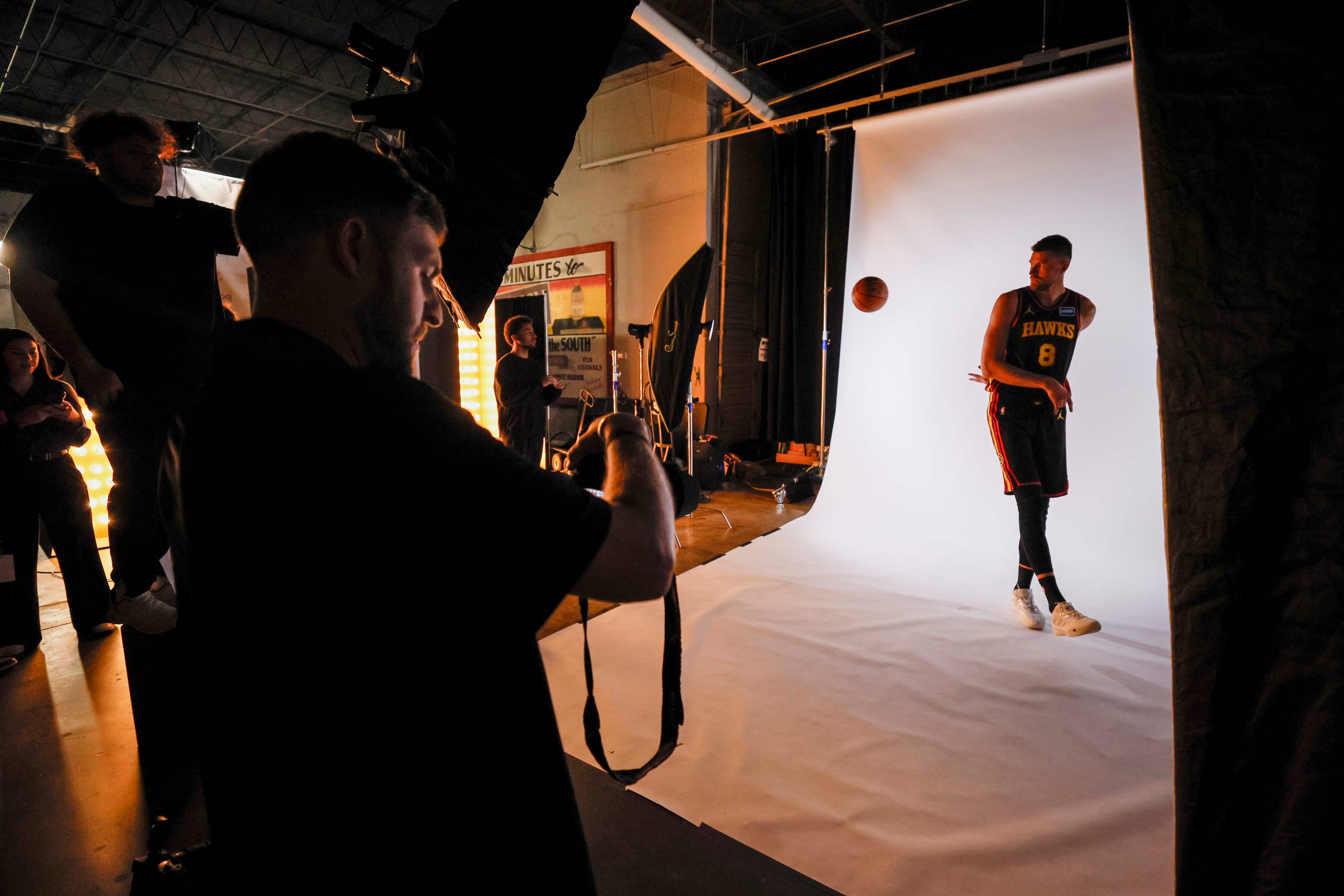 Atlanta Hawks center Kristaps Porzingis (8) handles the ball while posing for NBA photographer Adam Hagy during media day at PC&E Atlanta on Sept. 29, 2025, in Atlanta.
(Miguel Martinez/ AJC)