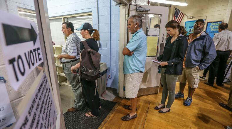 Voters line up on Tuesday, June 20, 2017, at the Hammond Park Gymnasium, as 6th District voters choose whether to send Republican Karen Handel or Democrat Jon Ossoff to Washington. JOHN SPINK/JSPINK@AJC.COM.