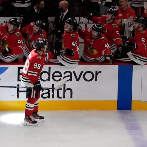Chicago Blackhawks center Connor Bedard (98) celebrates his goal against the Calgary Flames during the third period of an NHL hockey game Tuesday, Nov. 18, 2025, in Chicago. (AP Photo/David Banks)
