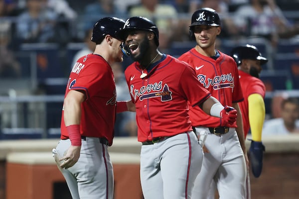 Michael Harris II (center) celebrates a Wednesday grand slam.