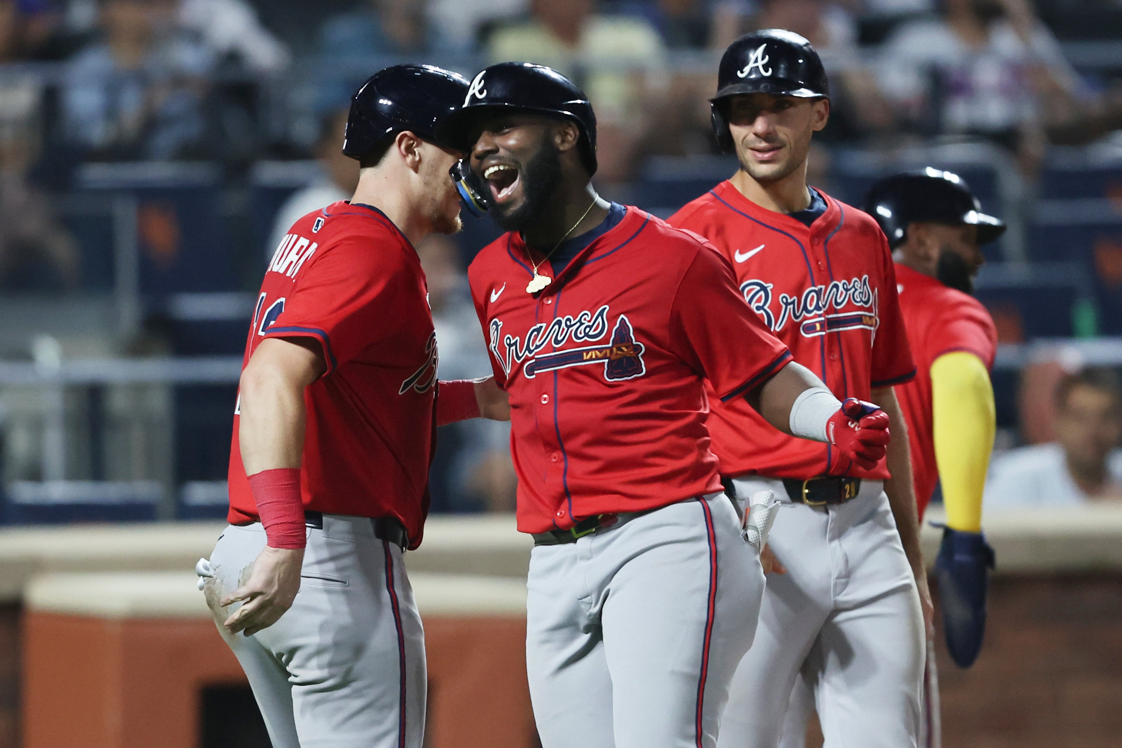 Michael Harris II (center) celebrates a Wednesday grand slam.