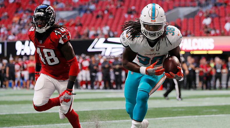 ATLANTA, GA - AUGUST 30:  Buddy Howell #38 of the Miami Dolphins catches a touchdown pass against Ron Parker #48 of the Atlanta Falcons at Mercedes-Benz Stadium on August 30, 2018 in Atlanta, Georgia.  (Photo by Kevin C. Cox/Getty Images)