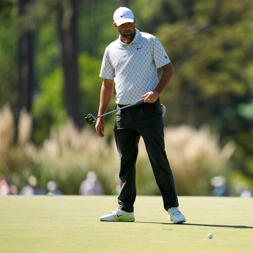 Scottie Scheffler reacts after missing a putt on the third hole during the second round of the Masters golf tournament at the Augusta National Golf Club, Friday, April 10, 2026, in Augusta, Ga. (AP Photo/Ashley Landis)
