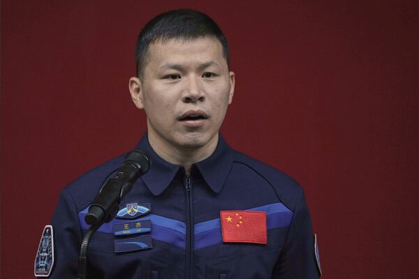 Chinese astronaut for the upcoming Shenzhou 20 mission Wang Jie speaks during a meeting with media members at the Jiuquan Satellite Launch Center in northwest China, Wednesday, April 23, 2025. (AP Photo/Andy Wong)