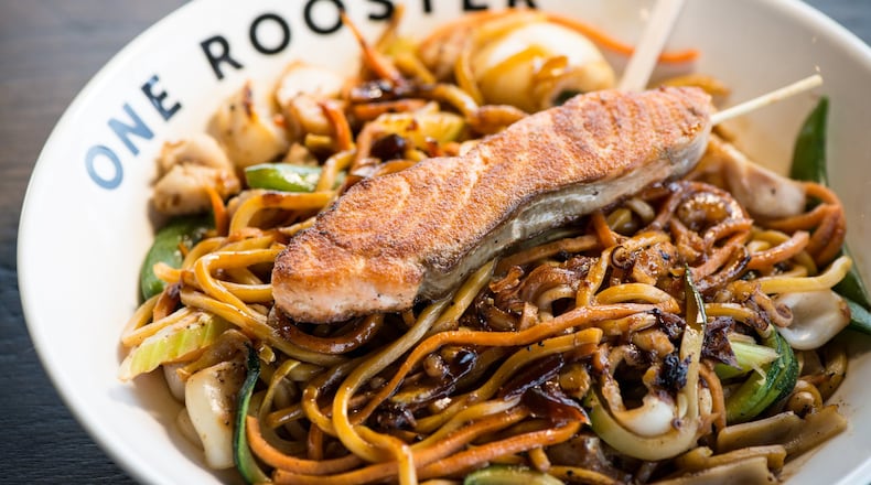 One Rooster Lo Mein bowl with calamari, veggies, ginger teriyaki sauce, and seared salmon. Photo credit - Mia Yakel.