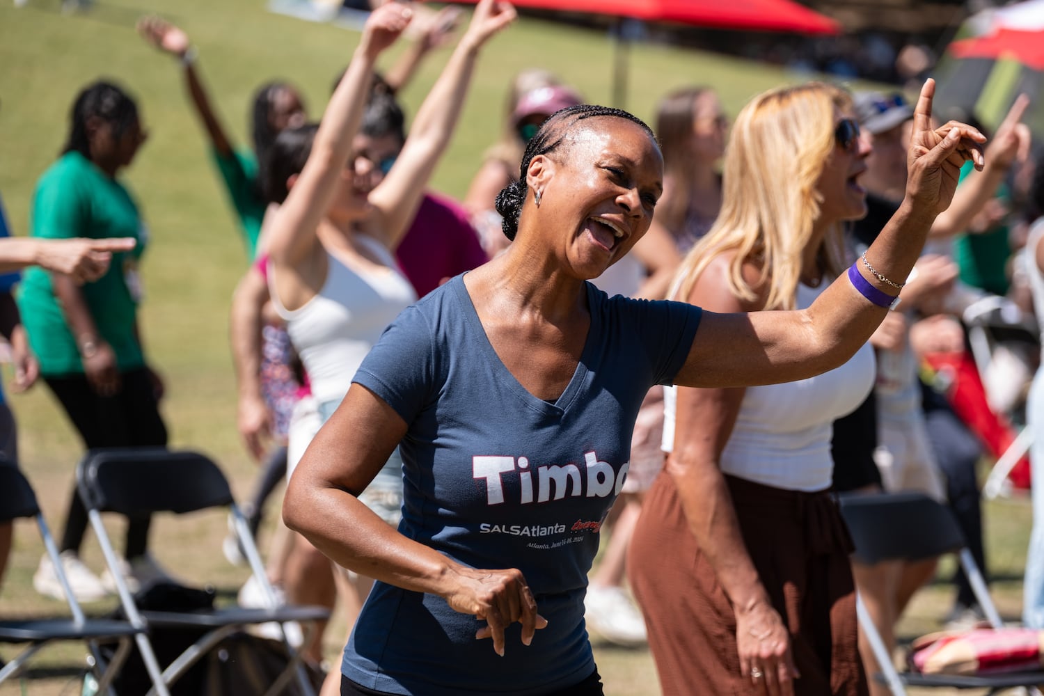 Sue Bickham dances with SALSAtlanta during the Atlanta Dogwood Festival at Piedmont Park on Saturday, April 11, 2026. (Ben Gray for the AJC)