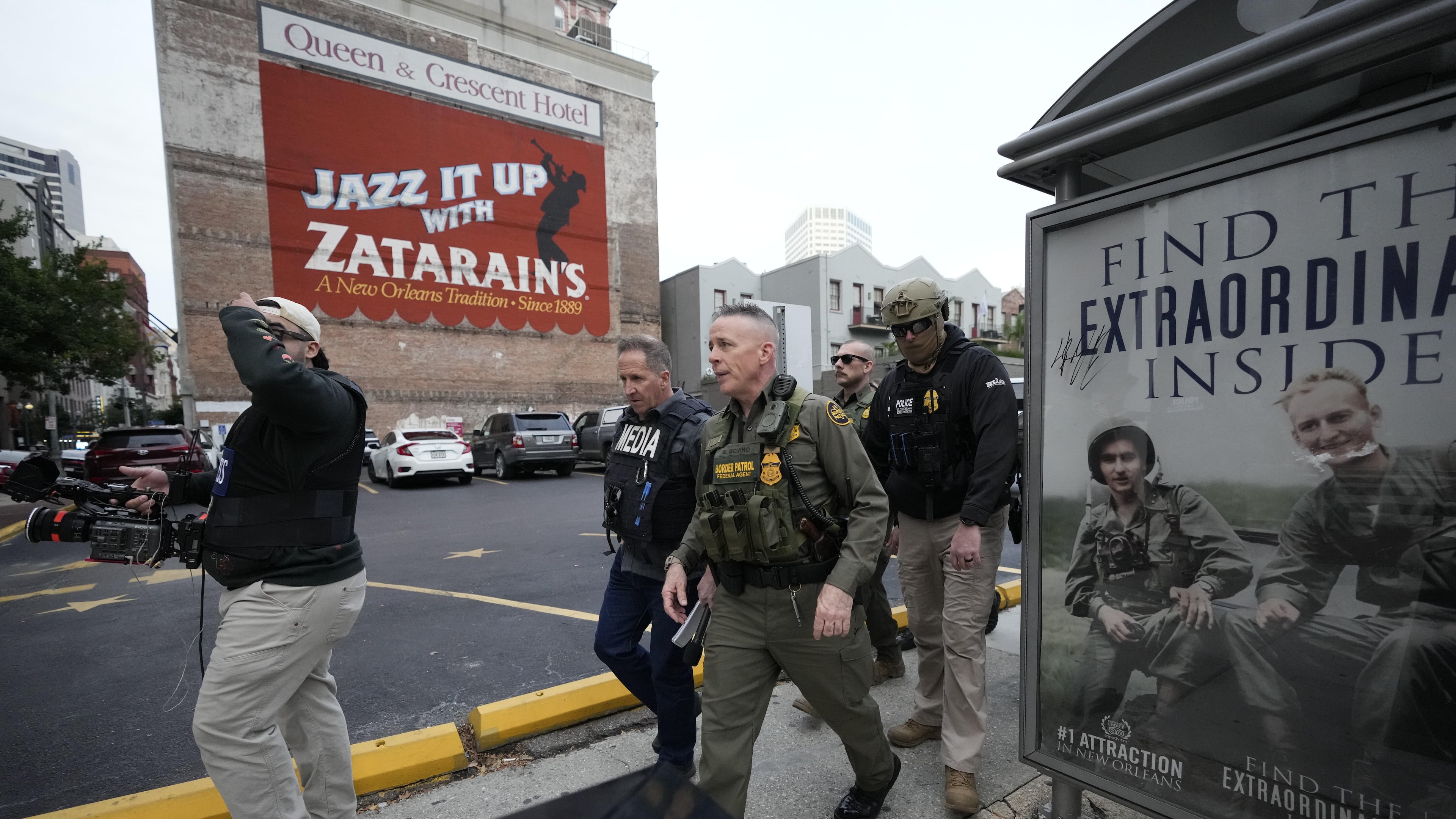 U.S. Border Patrol Commander at large Gregory Bovino, 3rd left, walks on the street in New Orleans, La.,Wednesday, Dec. 3, 2025. (AP Photo/Gerald Herbert)