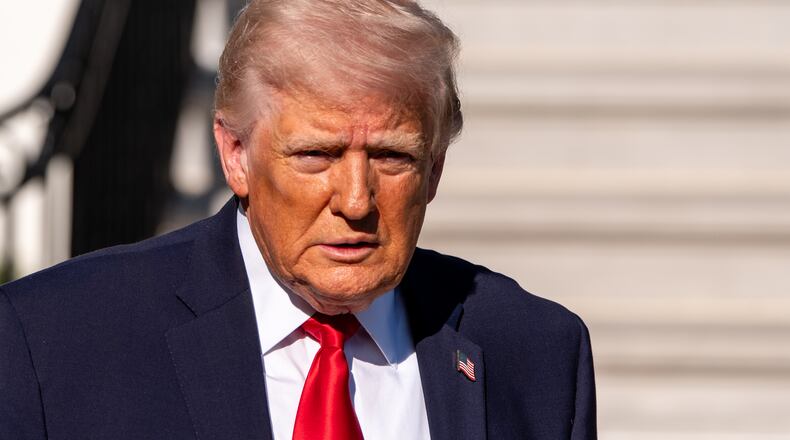 President Donald Trump speaks with reporters before departing on Marine One from the South Lawn of the White House, Saturday, April 11, 2026, in Washington. (AP Photo/Alex Brandon)