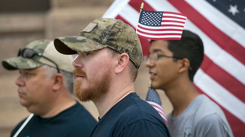 Veterans from the local area, including from left, Roberto Perez, Jr. and Chris Renfro, along with Perez's son Daniel, 16, met on the south steps of the Texas State Capitol Saturday May 20, 2017 to continue to bring awareness to the plight of the Veteran in the United States. The group was representing Veterans March On America and Victory For Veterans Foundation and their hope is to raise funds to assist other veteran organizations. The turnout was small due to inclement weather.
RALPH BARRERA/AMERICAN-STATESMAN