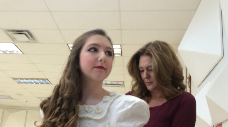Jennifer Houlihan helps her daughter Claire getting ready for a dress rehearsal. Photo: Jennifer Brett