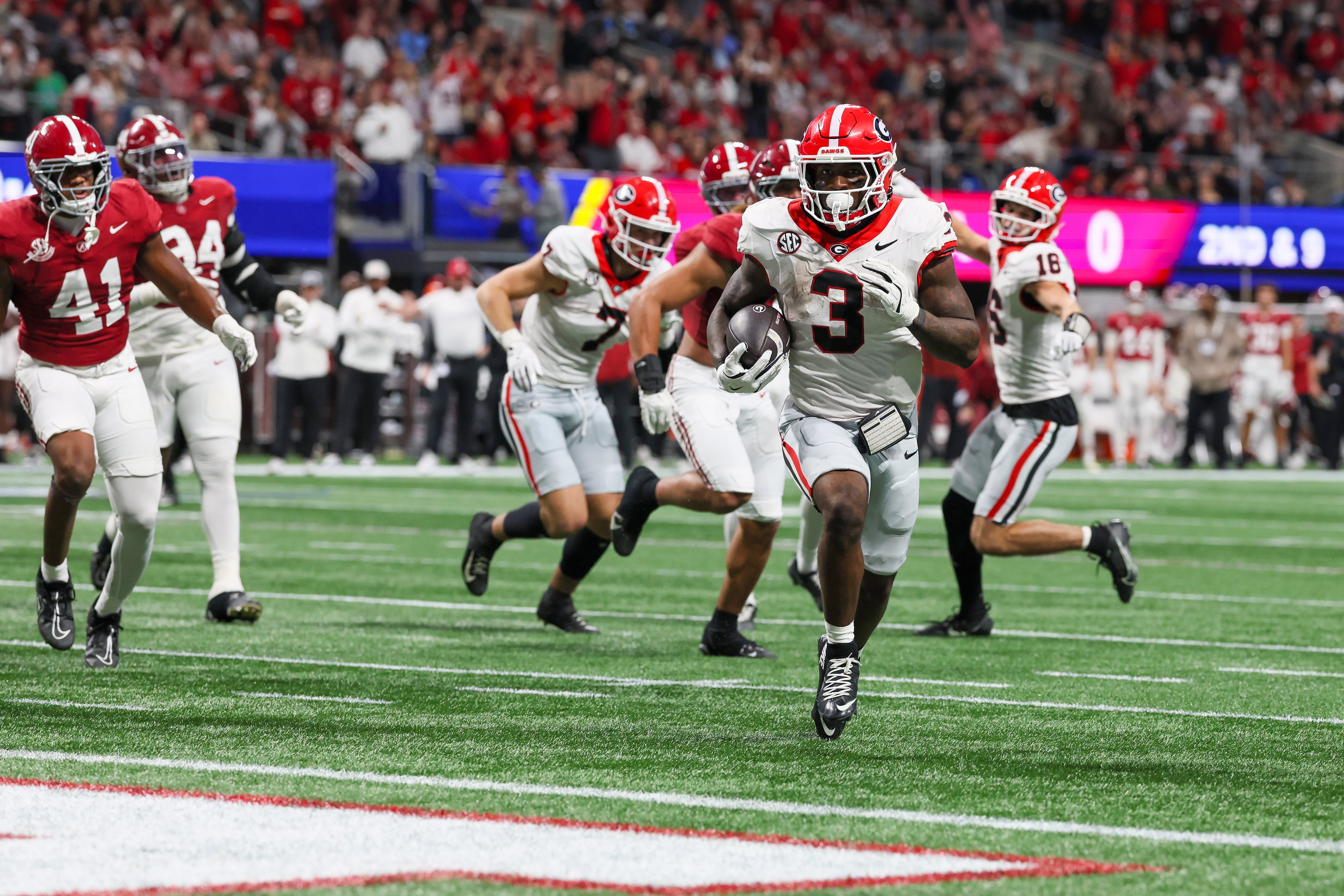 Georgia running back Nate Frazier (3) rushes for a nine yard touchdown against Alabama during the third quarter of the SEC Championship game at Mercedes-Benz Stadium, Saturday, Dec. 6, 2025, in Atlanta. (Jason Getz / AJC)