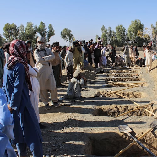 Locals prepare graves for victims of an overnight attack on a home that, according to an Afghan government spokesman, was carried out by Pakistan, in the Gurbaz district of Khost province, Afghanistan, Tuesday, Nov. 25, 2025. (AP Photo/Saifullah Zahir)