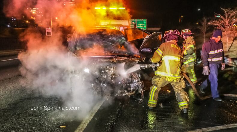 DeKalb County firefighters extinguished a car fire Thursday on I-285 West at Ashford Dunwoody Road.