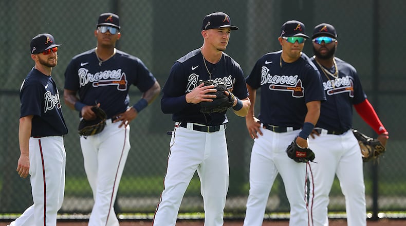 Braves outfielders Shane Robinson (from left), Cristian Pache, Drew Waters, Rafael Ortega, and Trey Harris get is some work in the outfield during spring training Wednesday, Feb. 19, 2020, at CoolToday Park in North Port, Fla.