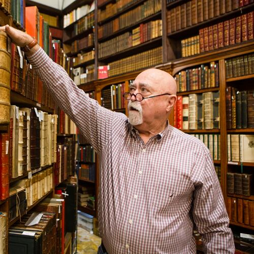 Sonny Ideker, owner of Sonny Ideker Bookseller, will participate in the first Atlanta Rare Book Fair, Friday through Sunday. At his shop inside Roswell's City Antiques, Ideker sells antiquarian and rare 16th to early 20th century books. (Christina Matacotta for the AJC 2022)