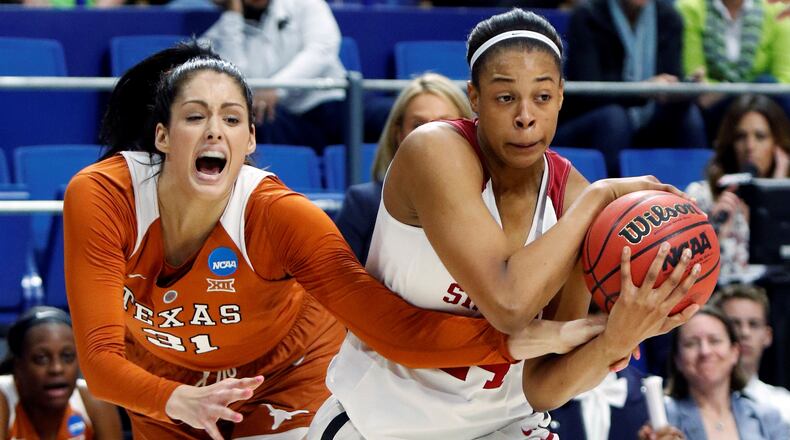 Stanford's Erica McCall, right, is pressured by Texas' Audrey-Ann Caron-Goudreau during a regional semifinal in the women's NCAA college basketball tournament in Lexington, Ky., Friday, March 24, 2017. Stanford won 77-66. (AP Photo/James Crisp)p