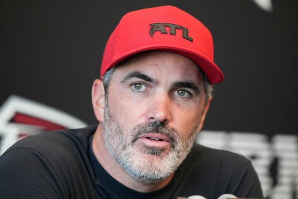 Falcons coach Kevin Stefanski, shown here speaking during a training camp practice in August, told reporters Wednesday the team could start any of their four active quarterbacks on Sunday. (Brynn Anderson/AP)