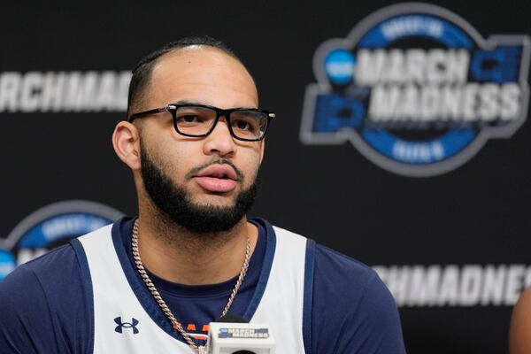 Auburn forward Johni Broome speaks during a news conference, Thursday, March 27, 2025, in Atlanta, ahead of the Sweet 16 in the NCAA college basketball tournament. (AP Photo/George Walker IV)