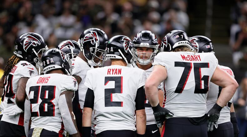 Atlanta Falcons quarterback Matt Ryan (2) huddles with the team during the first half of an NFL football game against the New Orleans Saints, Sunday, Nov. 7, 2021, in New Orleans. (AP Photo/Butch Dill)