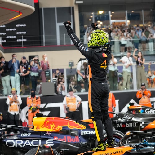 McLaren driver Lando Norris of Britain celebrates after becomin a rold champion after the Abu Dhabi Formula One Grand Prix in Abu Dhabi, United Arab Emirates, Sunday, Dec. 7, 2025. (AP Photo/Darko Bandic)