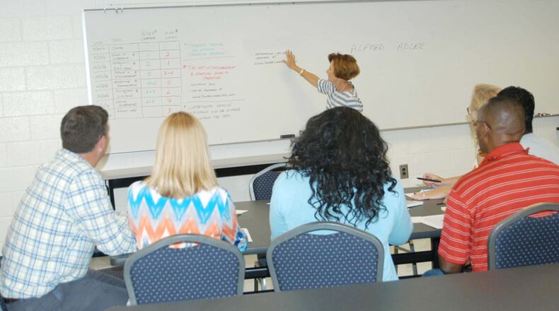 Social worker Karen Spangler gives introductory remarks to a class on Systematic Training for Effective Parenting, a course that s been offered for 20 years to families of students in Fayette County.