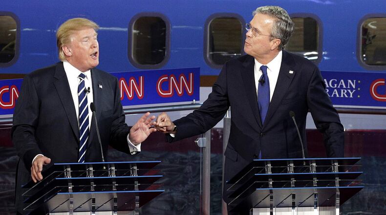 Donald Trump and Jeb Bush interact during the Republican candidates' debate, Sept. 16. Whittaker / The New York Times)