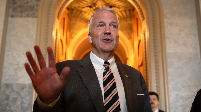 FILE - Sen. Dan Sullivan, R-Alaska, speaks to reporters at the Capitol in Washington, June 30, 2025. (AP Photo/Mark Schiefelbein)