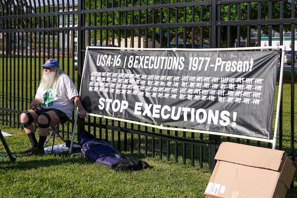 Ron Kaz demonstrates outside the site of the scheduled execution of South Carolina inmate Mikal Mahdi in Columbia, S.C., Friday, April 11, 2025. (AP Photo/David Yeazell)