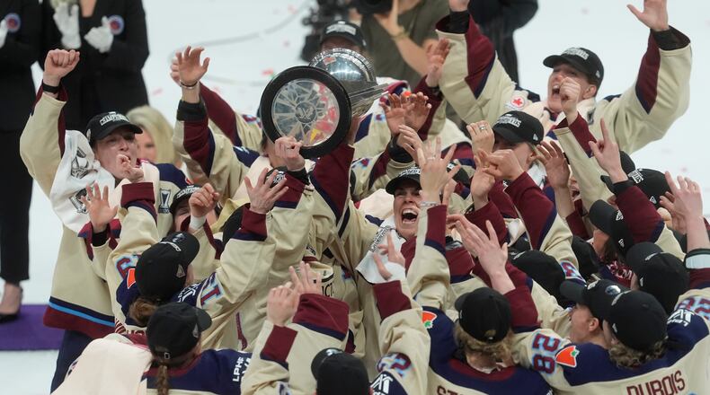 Montreal Victoire players celebrate after defeating the Ottawa Charge to win the PWHL Walter Cup final in Ottawa, Wednesday May 20, 2026. (Adrian Wyld/The Canadian Press via AP)