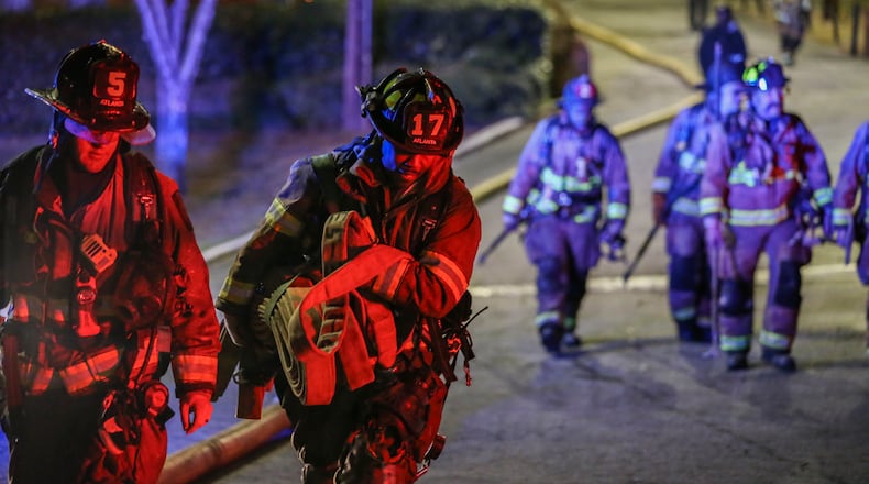 Firefighters battled the March 2017 blaze at the Venetian Hills Apartments on Campbellton Road, a fire that left one tenant, George Hughes, dead and more than 30 residents without a home. Now, a jury has ruled that the landlord must pay Hughes' family $140 million. (John Spink / AJC 2017 photo)