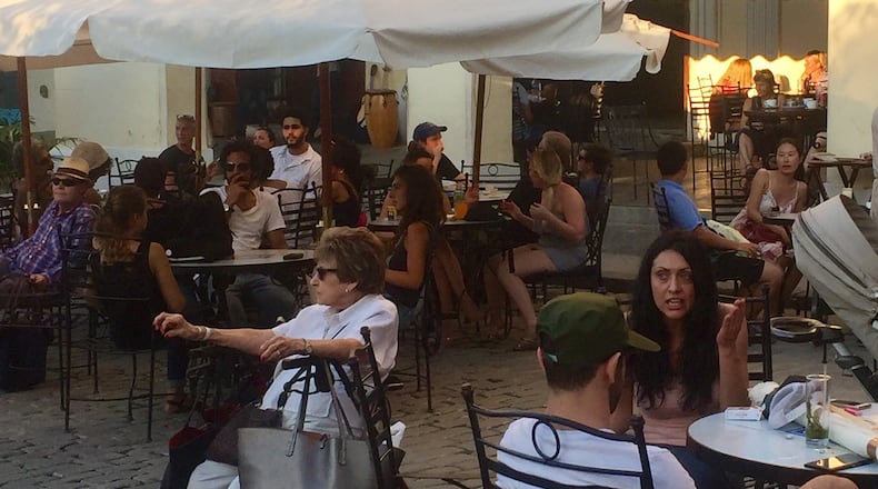 International visitors crowd Havana's Plaza de Armas in January 2017. (Mimi Whitefield/Miami Herald/TNS)