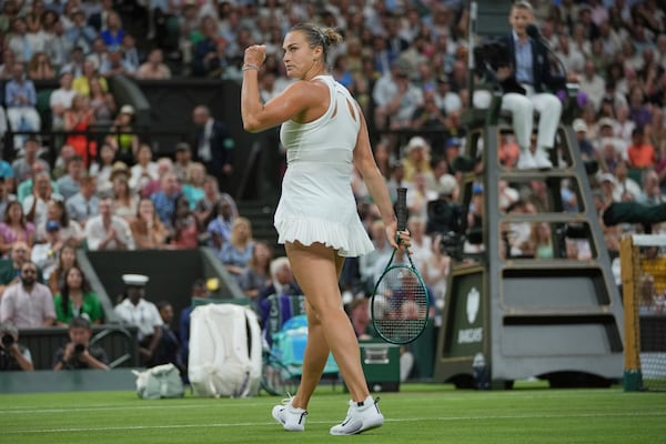 Aryna Sabalenka of Belarus reacts after winning the first set against Emma Raducanu of Britain during a third round women's singles match at the Wimbledon Tennis Championships in London, Friday, July 4, 2025. (AP Photo/Kin Cheung)