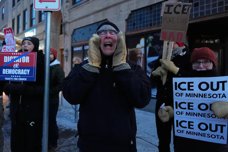 A demonstrator shouts during a rally against federal immigration enforcement on Wednesday, Jan. 28, 2026, in Minneapolis. (Julia Demaree Nikhinson/AP)