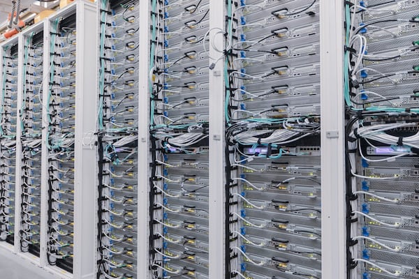 Data centers, with their many racks of computers and storage blades, create an economy of scale that is far more efficient and secure than having computer storage spread out among various offices and institutions. (Courtesy of Microsoft)