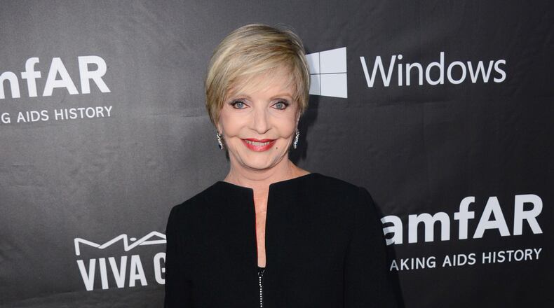 FILE - In this Oct. 29, 2014 file photo, Florence Henderson arrives at the 2014 amfAR Inspiration Gala at Milk Studios in Los Angeles. Henderson, the wholesome actress who went from Broadway star to television icon when she became Carol Brady, the ever-cheerful mom residing over "The Brady Bunch," has died at age 82. She died surrounded by family and friends, her manager, Kayla Pressman, said in a statement late Thursday, Nov. 24, 2016. (Photo by Jordan Strauss/Invision/AP, File)