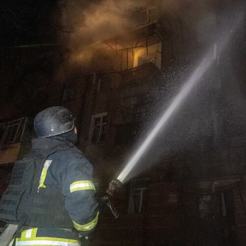 Emergency services personnel work to extinguish a fire following a Russian attack in Kharkiv, Ukraine, Saturday, Jan. 24, 2026. (AP Photo/Andrii Marienko)