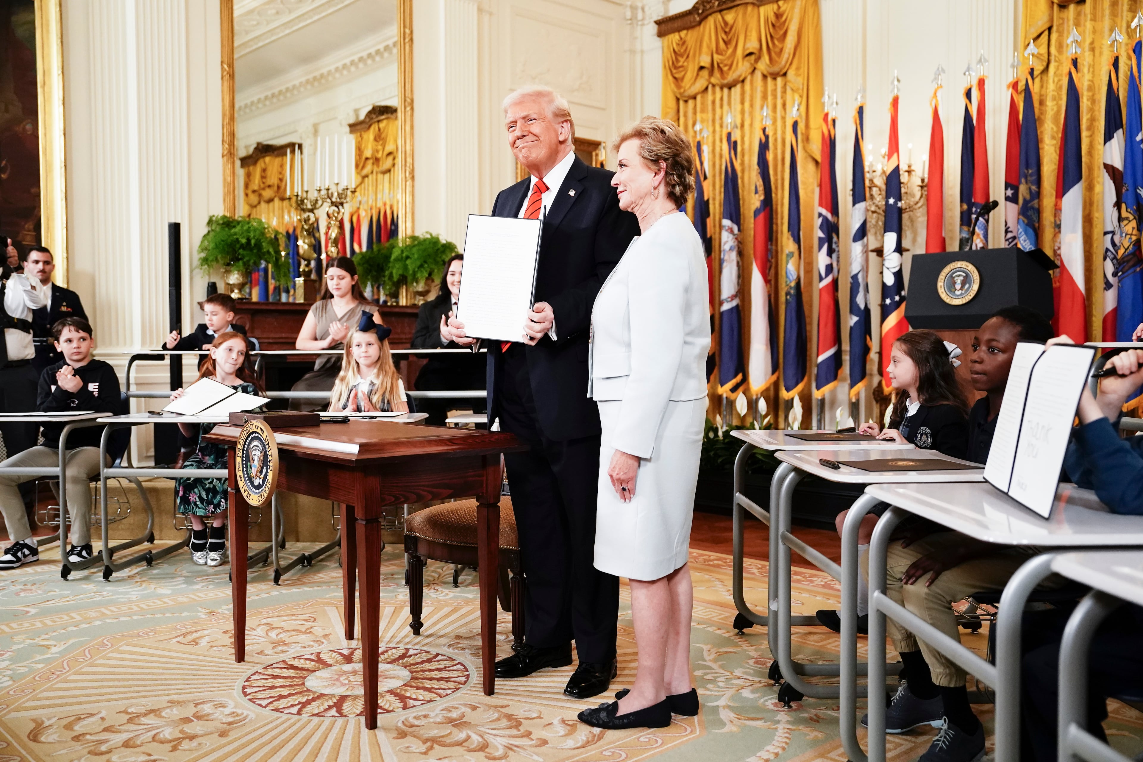 President Donald Trump with Education Secretary Linda McMahon after he signed an executive order that would diminish the Department of Education in East Room of the White House in Washington, on Thursday, March 20, 2025. President Trump signed an executive order that he said would “begin eliminating the federal Department of Education once and for all,” although the agency cannot be closed without the approval of Congress (Haiyun Jiang/The New York Times)