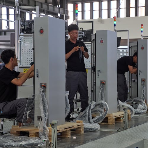 FILE - Workers assemble charging stations at the Mengma Intelligent Transportation Equipment Manufacturing Base in Hohot in northern China's Inner Mongolia province on Thursday, June 11, 2026. (AP Photo/Ng Han Guan, file)