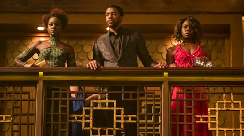 This image released by Disney and Marvel Studios' shows Lupita Nyong'o, from left, Chadwick Boseman and Danai Gurira in a scene from "Black Panther." (Matt Kennedy/Marvel Studios/Disney via AP)