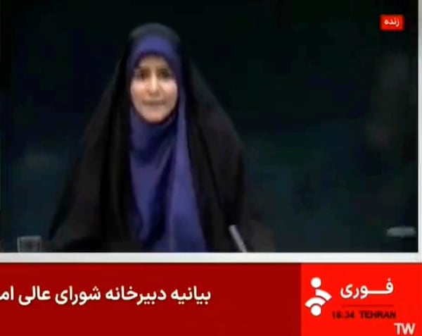 This frame grab from a video released by Iran state TV shows anchor Sahar Emami amid an explosion from an Israeli attack during a live TV broadcast, June 16, 2025, in Tehran, Iran. (Iran state TV, IRINN via AP)