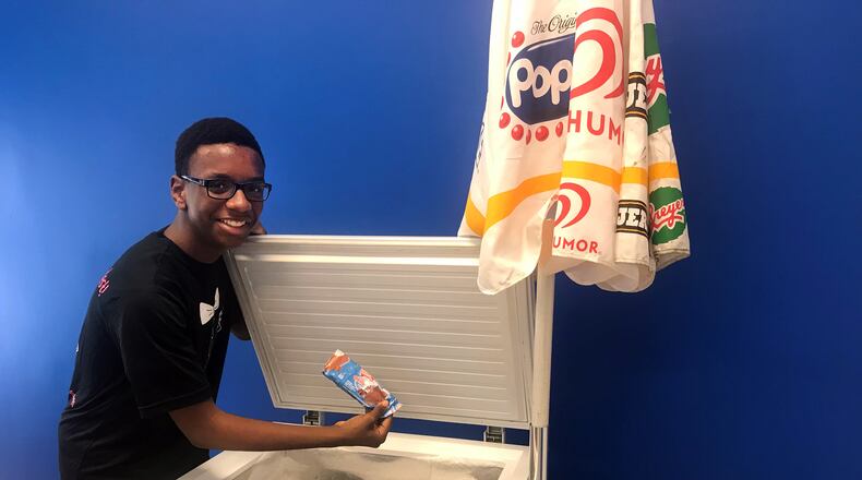 Beau Shell has been selling ice cream since he was 8 years old. Now aged 14, the owner of Lil’ Ice Cream Dude is planning to open a brick-and-mortar shop in east Athens. Here, Shell stands with his first ice cream cart, one he named Firecracker. LIGAYA FIGUERAS / LFIGUERAS@AJC.COM