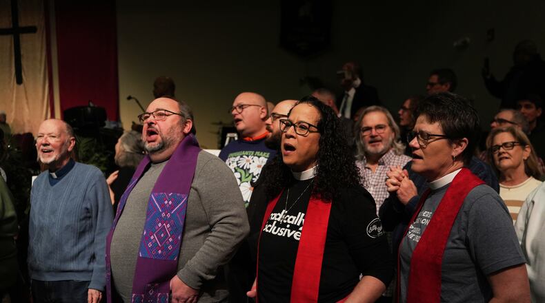 Faith leaders sing together as a sign of support for Haitian migrants fearing the end of their Temporary Protected Status in the U.S., at an event held at St. John Missionary Baptist Church in Springfield, Ohio on Monday, Feb. 2, 2026. (AP Photo/Luis Andres Henao)