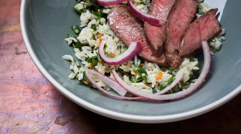 This coconut rice and Thai beef uses the lighter, drinkable coconut milk, not the thicker coconut milk available in cans. Deb Lindsey for The Washington Post