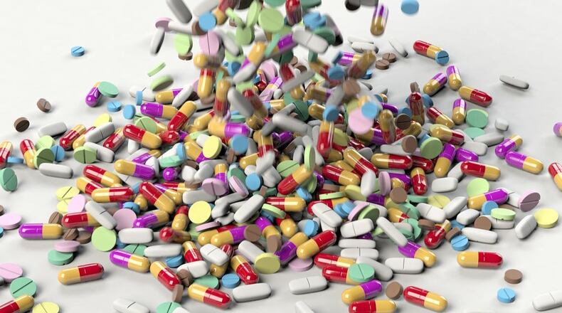 A bar owner in Michigan and two of his waitresses are accused of selling pills illegally.