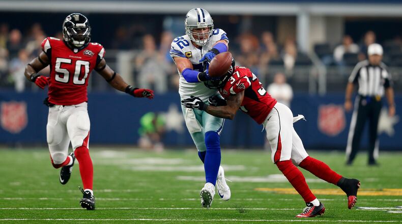 Dallas Cowboys tight end Jason Witten (82) has a pass to him broken up by Atlanta Falcons free safety Ricardo Allen (37) in the second half of an NFL football game Sunday, Sept. 27, 2015, in Arlington, Texas. The Falcons' O'Brien Schofield (50) watches on the play. (AP Photo/Brandon Wade)