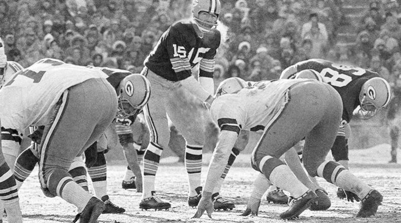 FILE - In this Dec. 31, 1967, file photo, Green Bay Packers quarterback Bart Starr calls signals in bitter cold as he led the Packers to a 21-14 win over the Dallas Cowboys to capture third consecutive National Football League title in Green Bay, Wisc. In the history of NFL games, none stands out for the brutal conditions in which it was played like the NFC championship on the last day of 1967. Simply dubbed the Ice Bowl, those who participated in Cowboys-Packers that day at Lambeau Field still shiver when talking about it. (AP Photo/File)